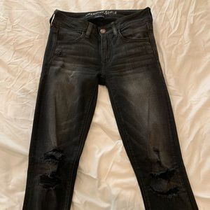 Mid rise, black distressed skinny jeans